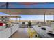 Inviting outdoor space with a view, featuring a comfortable seating area and an adjacent dining setup at 11 Cloud Chaser Blvd, Henderson, NV 89012