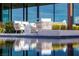 Beautiful poolside lounge area with comfortable seating and attractive landscaping at 11 Cloud Chaser Blvd, Henderson, NV 89012