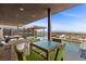 Outdoor pool area with comfortable seating, a dining space, and breathtaking panoramic views at 11 Cloud Chaser Blvd, Henderson, NV 89012