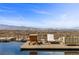 Stunning infinity pool featuring lounge chairs and breathtaking panoramic city views at 11 Cloud Chaser Blvd, Henderson, NV 89012