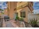 Fenced backyard with pavers, greenery and access to the home at 11159 African Sunset St, Henderson, NV 89052