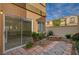 A fenced backyard showcasing a patio area and landscaping at 11159 African Sunset St, Henderson, NV 89052
