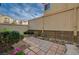 A fenced backyard with plants and pavers at 11159 African Sunset St, Henderson, NV 89052