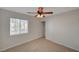 A well-lit bedroom with a ceiling fan and a window at 11159 African Sunset St, Henderson, NV 89052