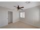 A bedroom with a ceiling fan and a closet at 11159 African Sunset St, Henderson, NV 89052