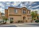 Inviting two-story home featuring desert landscaping, a balcony, and an attractive stucco facade at 11159 African Sunset St, Henderson, NV 89052