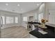 Eat-in kitchen area featuring stainless steel appliances, white cabinets, and black granite countertops at 11159 African Sunset St, Henderson, NV 89052