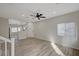 Spacious living room with wood flooring, recessed lighting, and open access to the kitchen and dining area at 11159 African Sunset St, Henderson, NV 89052