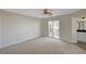 Spacious main bedroom featuring carpet, ensuite bathroom, and sliding glass door at 11159 African Sunset St, Henderson, NV 89052