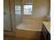Bathroom featuring a standalone bathtub and shower at 11489 Belmont Lake Dr # 106, Las Vegas, NV 89135
