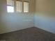 Standard bedroom with three large horizontal windows at 11489 Belmont Lake Dr # 106, Las Vegas, NV 89135