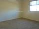 Cozy bedroom with neutral paint, carpet, and good natural lighting at 11489 Belmont Lake Dr # 106, Las Vegas, NV 89135
