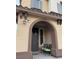 Inviting front porch featuring an arched entry, seating, and stylish decor at 11489 Belmont Lake Dr # 106, Las Vegas, NV 89135