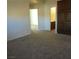 Cozy living room featuring plush carpeting and access to the bathroom and bedroom at 11489 Belmont Lake Dr # 106, Las Vegas, NV 89135