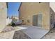 Backyard with a concrete patio, providing a perfect outdoor space for relaxation and entertaining at 12045 Yarrow Ridge Ct, Las Vegas, NV 89183