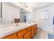 Bathroom featuring double sinks and a large mirror, offering functionality at 1312 Pacific Terrace Dr, Las Vegas, NV 89128