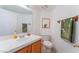 Clean bathroom featuring a white vanity, toilet, and decorative accents for a fresh feel at 1312 Pacific Terrace Dr, Las Vegas, NV 89128