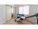 Bright bedroom featuring a mirrored closet door and natural light at 1312 Pacific Terrace Dr, Las Vegas, NV 89128