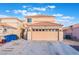 Charming two-story home showcasing a neutral color palette, tile roof and attached two-car garage at 1312 Pacific Terrace Dr, Las Vegas, NV 89128