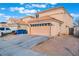 Charming two-story home showcasing its neutral color palette, tile roof and attached two-car garage at 1312 Pacific Terrace Dr, Las Vegas, NV 89128