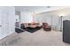 Spacious living room featuring a sectional sofa, recliner, ceiling fan, and large windows at 1312 Pacific Terrace Dr, Las Vegas, NV 89128