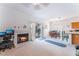 Inviting living space featuring a cozy fireplace, sliding glass doors, and adjacent dining area at 1312 Pacific Terrace Dr, Las Vegas, NV 89128