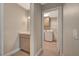 Bathroom and laundry room with neutral-toned cabinets at 2061 Smoketree Village Cir, Henderson, NV 89012