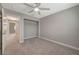Bedroom with a closet, a ceiling fan, and neutral carpet at 2061 Smoketree Village Cir, Henderson, NV 89012