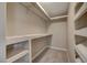 Walk-in closet providing ample storage space with custom shelving at 2061 Smoketree Village Cir, Henderson, NV 89012