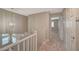 Upstairs hallway showcasing modern lighting and hallway to a bedroom at 2061 Smoketree Village Cir, Henderson, NV 89012