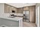 Well-equipped kitchen boasts stainless appliances, stone counters, and ample cabinet space at 2061 Smoketree Village Cir, Henderson, NV 89012
