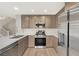 Kitchen featuring stainless steel appliances and a modern design at 2061 Smoketree Village Cir, Henderson, NV 89012