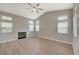 Bright living room with hardwood floors, fireplace, and plenty of natural light at 2061 Smoketree Village Cir, Henderson, NV 89012