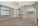 Bright living area with hardwood floors, staircase, and an open concept layout at 2061 Smoketree Village Cir, Henderson, NV 89012