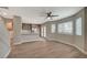 Open-concept living area flows into the kitchen with modern finishes and bright lighting at 2061 Smoketree Village Cir, Henderson, NV 89012
