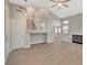 Open concept living space with hardwood floors, fireplace and a staircase at 2061 Smoketree Village Cir, Henderson, NV 89012
