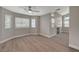 Spacious living room features wood floors, fireplace and multiple windows at 2061 Smoketree Village Cir, Henderson, NV 89012
