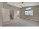 Large main bedroom features high ceiling, fan, and access to ensuite bath and closet at 2061 Smoketree Village Cir, Henderson, NV 89012