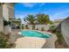 Private pool with tropical landscaping and block wall fencing at 2061 Smoketree Village Cir, Henderson, NV 89012