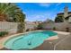 Inviting backyard featuring a private pool, landscaping, and block fencing at 2061 Smoketree Village Cir, Henderson, NV 89012