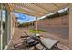 Relaxing backyard with a pergola-covered patio, lounge chairs, and low-maintenance landscaping at 2345 Hot Brook Point St, Las Vegas, NV 89134