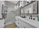 Modern bathroom featuring double sinks, a walk-in shower, and sleek fixtures at 2345 Hot Brook Point St, Las Vegas, NV 89134