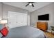 Comfortable bedroom featuring a ceiling fan, closet, and wood-look flooring at 2345 Hot Brook Point St, Las Vegas, NV 89134