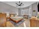 Serene bedroom with a wooden bed frame, soft lighting, and bright windows at 2345 Hot Brook Point St, Las Vegas, NV 89134