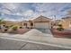 Charming single story home with desert landscaping, paved driveway, and attached two car garage at 2345 Hot Brook Point St, Las Vegas, NV 89134