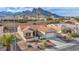 Inviting single-story house features a terra cotta roof and desert landscaping, set against a backdrop of majestic mountains at 2345 Hot Brook Point St, Las Vegas, NV 89134