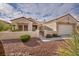 This charming single-story home boasts a terra cotta roof, an attached two car garage and low-maintenance desert landscaping at 2345 Hot Brook Point St, Las Vegas, NV 89134