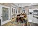 Charming kitchen and dining area featuring stainless steel appliances, an island with seating, and an adjacent dining area at 2345 Hot Brook Point St, Las Vegas, NV 89134