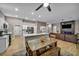 Open-concept living space seamlessly connects kitchen, dining, and the inviting living room with a fireplace at 2345 Hot Brook Point St, Las Vegas, NV 89134