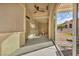 Covered patio area with a ceiling fan, dining table, and access to backyard at 2345 Hot Brook Point St, Las Vegas, NV 89134
